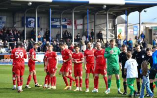 Swindon players line up before Barrow