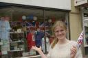 Becky Daniels with the King's Coronation display at the British Red Cross shop in Chippenham.