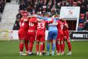 Swindon Town players in a huddle