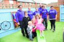 Josselin Tilley with mum Karen  and brothers Alex and Dalton-Lee with the WellChild team, lead by Lee Trunks, back left,  with Kathryn Rodd, Carla Tolhursh, Chris Morter, Faye Waterfield and Hatti Burge