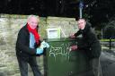 Bradford Town Mayor Cllr John Potter and resident Andrew Rolph using the graffiti response kit to clean up graffiti in the town