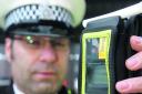 A police officer ready to carry out a breath test