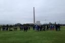 Crowds gather for the demolition of the Westbury chimney.