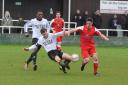 Corsham’s James Lye (red) is beaten to the ball against Roman Glass. PICTURE: SIOBHAN BOYLE