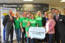 The Midcounties Co-operative presents cheques to local groups and charities in Swindon