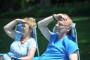 Celia and David Adams enjoy the sunshine at Coate Water Country Park. Picture by Dave Cox