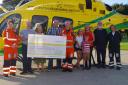 Wiltshire Air Ambulance paramedics Jo Munday, Steve Riddle and pilot Nicky Smith with former members of That's Entertainment
