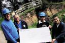 Sponsored walk organiser Peter Williams, right, presents a cheque to trust members Brian De’Ath, left, and Linda and Bob Howlett