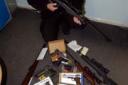 PC Dave Castle with the array of airguns siezed (18469/3/2) 