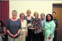 Chippenham Doorway cooks Ali, Vicki, Jackie, Kate and Indu receive the community award from Linda Packard, centre, chairman of Chippenham Area Board while, right, Lisa Lewis, chief executive of Doorway, watches