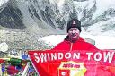 Martin Wannell with the Town flag at Everest base camp
