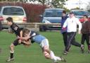 Andy Saunders shakes off a Newbury tackler