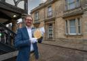 Britannia Coin Company owner Jon White outside the premises holding a recently sold 5kg gold coin, struck by the Royal Mint to celebrate the Platinum Jubilee