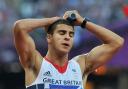 Danny Talbot's Team GB team-mate Adam Gemili shows his disappointment after tonight's 4x100m relay heat