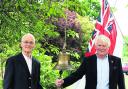 Robin Mitchell and his neighbour Ian Richards with the bell at Wyatt Court, Devizes, today
