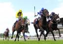 Al Kazeem and jockey James Doyle (blue and white cap) win the Tattersalls Gold Cup during the Tattersalls Irish Guineas Festival at The Curragh