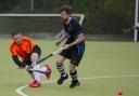 Devizes’ Rob Riddle (black shirt) closes down Swindon’s Tom Taylor during Devizes’ 3-2 Conference North defeat on Saturday  Picture by Dave Cox