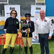 Kitty King (centre) celebrates her win at the Nunney International Horse Trials