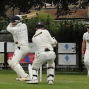 Chippenham v Biddestone Cricket.  Bails fly as Biddestone batsman Dwaine Perry  is out . Photo Trevor Porter  60491 8..