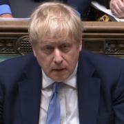 Prime Minister Boris Johnson listens as Labour leader Sir Keir Starmer responds to his statement to MPs in the House of Commons on the Sue Gray report. Picture date: Monday January 31, 2022..