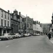 This picture feature shows Malmesbury scenes through the decades from the 1960s to the 1990s. Above is Malmesbury high street in 1964, showing very few cars on the road