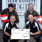 Front Chris Elias, Martin Lloyd; back, Sgt Ian Mason, and WO2 Jack Barnett with the cash collected