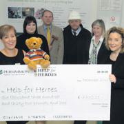 Bernice Brady of Help for Heroes, Gemma Ravenshill of Hilditch, auctioneer Neill Saint, contract manager Chris Liston, Christine Florence and Catherine Marshall of Persimmon