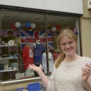 Becky Daniels with the King's Coronation display at the British Red Cross shop in Chippenham.