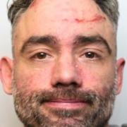 Russell Bond, 41, is wanted for assault and criminal damage