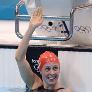 Hannah Miley smiles after winning her 400m IM heat this morning