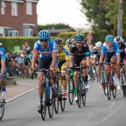 Sir Bradley Wiggins flanked by other Tour of Britain riders in Rushall