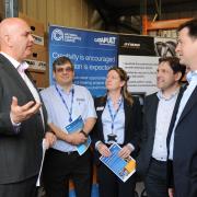Dymag’s chief executive Chris Shelley, left, speaks to Lib Dem leader Nick Clegg, far right, watched by Nigel Keen and Mary Page, of National Composites, and Duncan Hames. By Trevor Porter