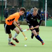Devizes’ Ollie Smith (black) takes on Swindon’s Pete Gilbert during their 3-0 home defeat in Conference North