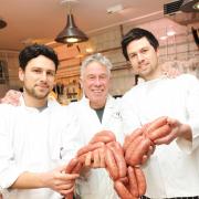 Devizes butchers,Walter Rose and Sons are selling sausages to raise money for Julia's House Appeal. Pictured are owner Steve Cook (centre) with sons l-r Jack and Charlie Cook.Siobhan Boyle (SMB823/3). (54667052)