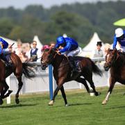 Barney Roy ridden by jockey James Doyle (right) comes home to win the St James's Palace Stakes