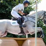 Harry Meade, riding Away Cruising during the cross country phase of the Land Rover Burghley Horse Trials