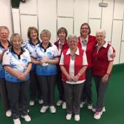 Clarrie Dunbar (blue) and North Wilts (red) players line up ahead of their Mason Trophy match. Pictured are (from left) Jeanette Wheeler, Ruth Jupp, Sue Bird, Pam Trippitt, Sue Cooke, Margaret Cook, Bev Lilley, Jean Collier.