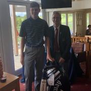 Rory Cameron celebrates winning the gross competition at the Upavon Golf Club Junior Open