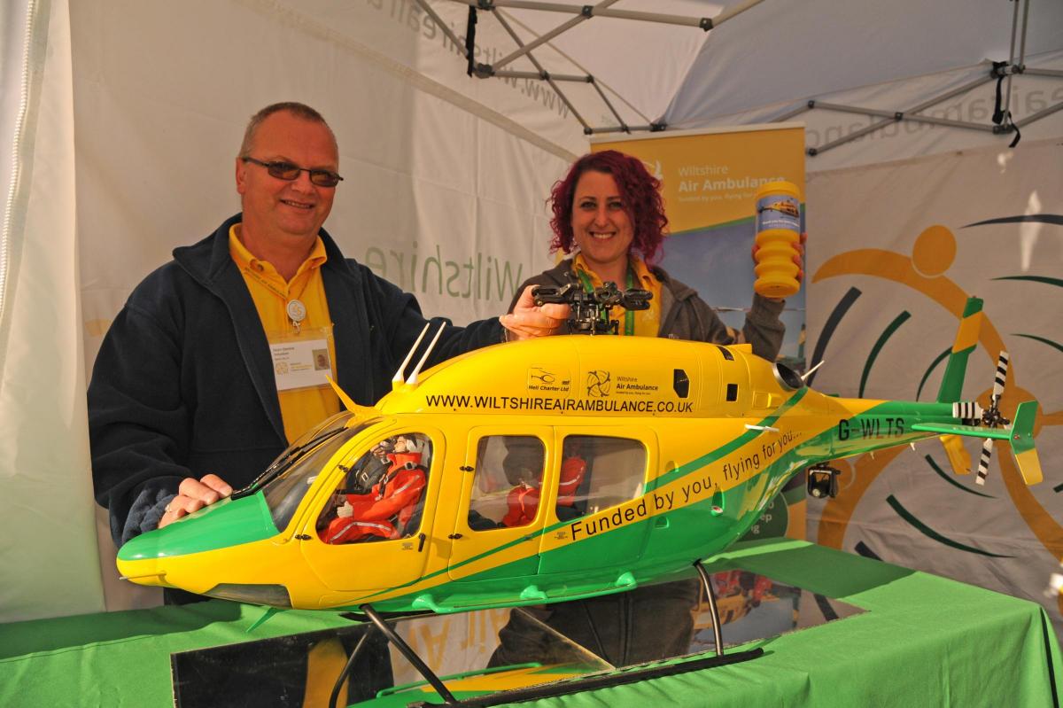 Sean Devine, of Urchfont, shows his model of the Wiltshire Air Ambulance with fundraising manager Rebecca de La  Bedoyere at the Wiltshire Big Wheel event