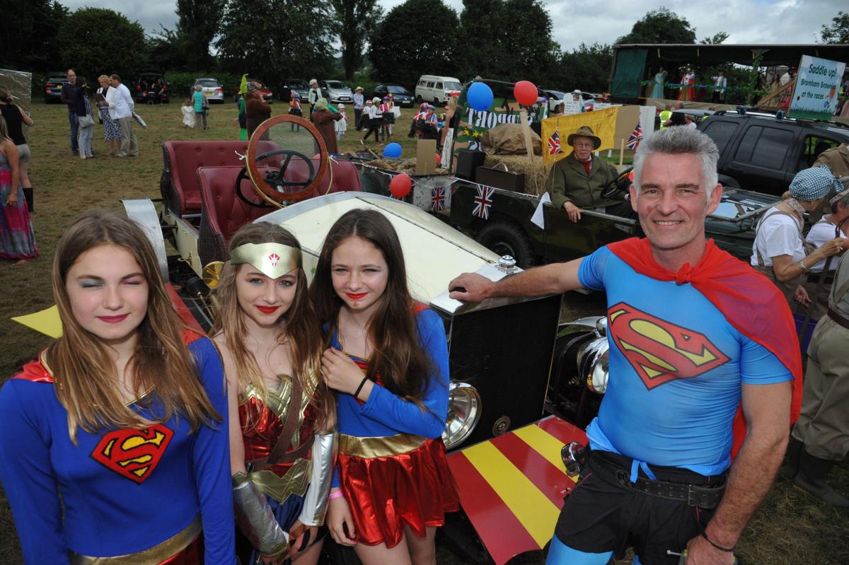 Super heroes Robert Sjore with Charlotte, Alice and Camilla at Bromham Carnival. Picture by Trevor Porter