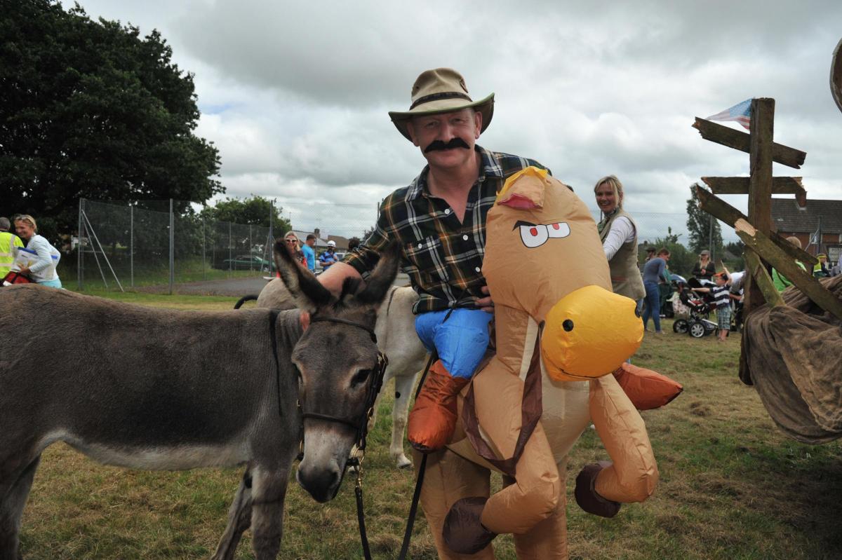Craig Dalby with his donkey Rosie and an inflatable friend. 
Picture by Trevor Porter