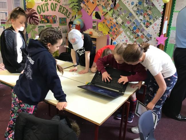 Year 6 pupils, from Corsham Primary School, work to crack cyber codes and escape the room