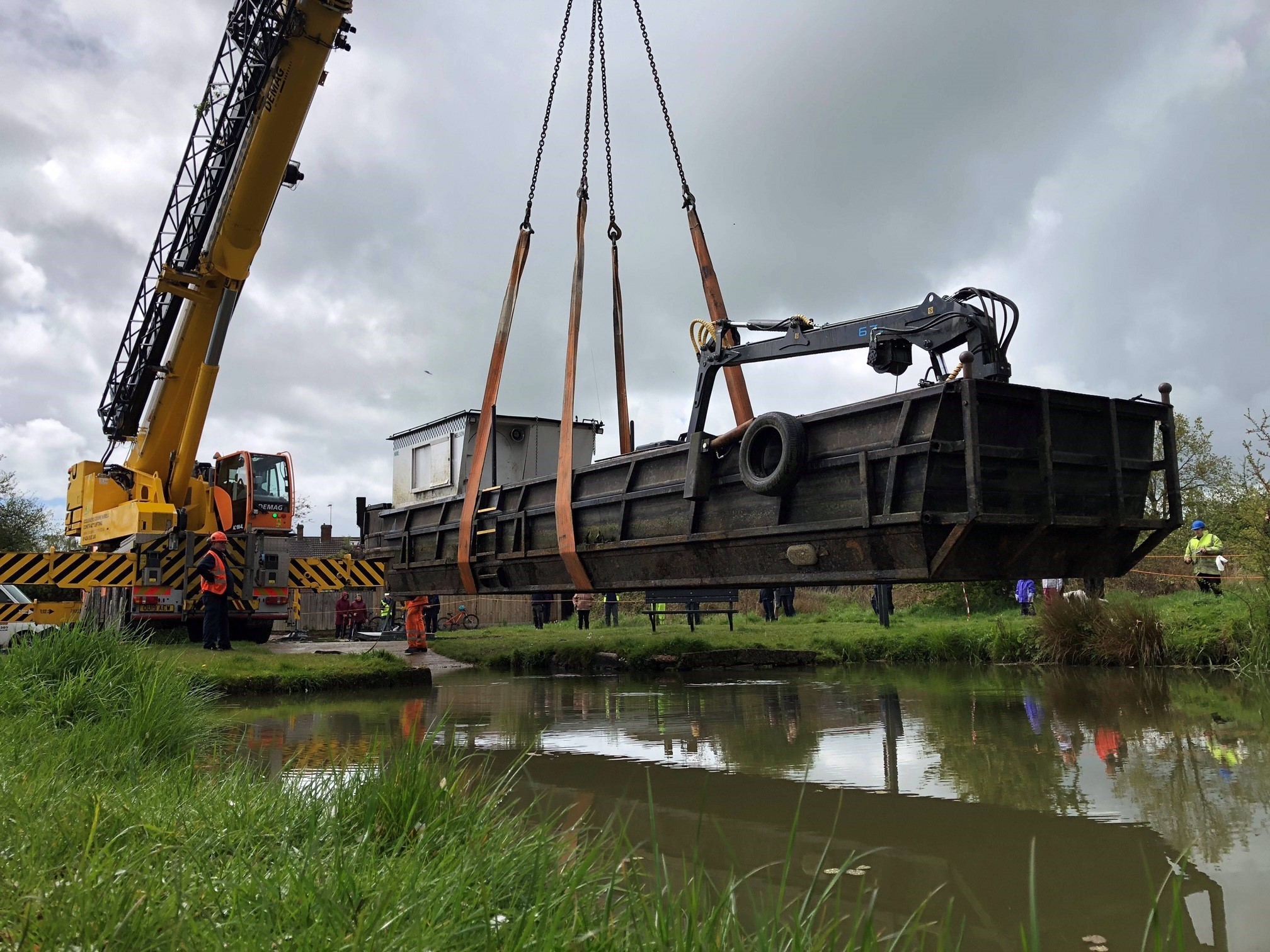 The dredger being lowered into the canal. Photo by Alex Hutchings