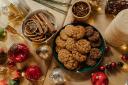 A selection of cookies on a festively decorated table. Credit: Canva