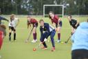 Team Gb and England Hockey player Tess Howard leads a coaching session at a school hockey club in 2019 PIcture: Stuart Walker