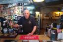 Alan Walters behind the bar of The Crown Inn