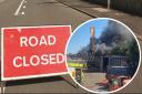 The road closure sign with a picture of the fire inset