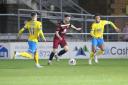 Action from last season's FA Trophy clash between Torquay United (yellow) and Chippenham Town