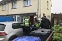 Police raid a home in Devizes