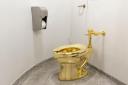 The solid gold toilet was installed in Blenheim Palace (Tom Lindboe/Blenheim Art Foundation/PA)